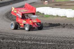Drift around the oval driving a race car on dirt track Albany, New York.