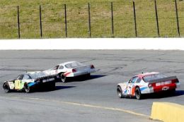 A high-speed driving experience at Madison International Speedway.