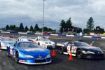 Speeds around the track at Lancaster National Speedway, Buffalo, NY in a NASCAR style race car.